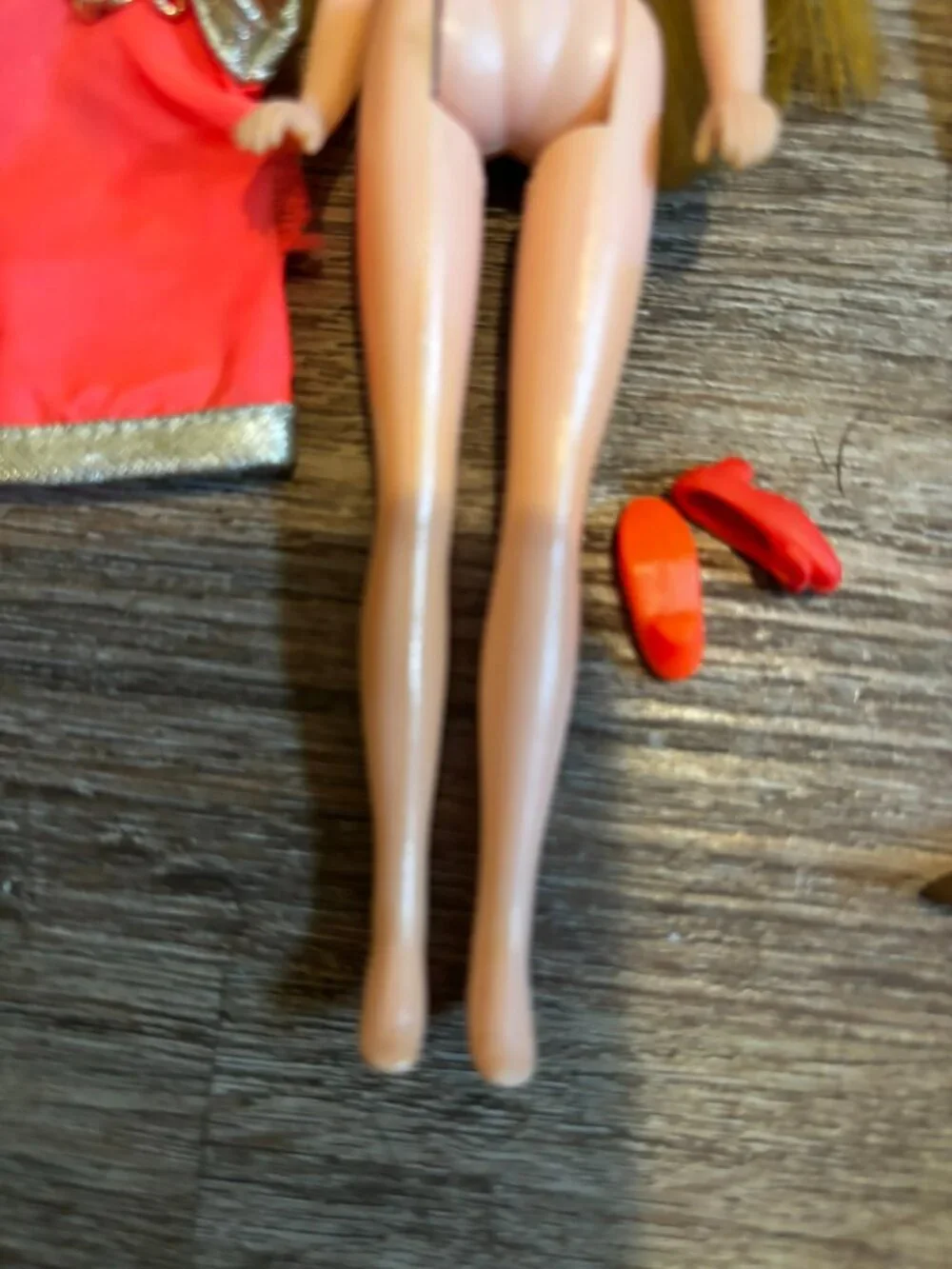 Topper Dawn Fancy Feet doll wearing orange and silver straight hard legs
